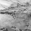 Oblique aerial view centred on the remains of the homestead moat, taken from the SW.