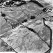 Dalawoodie and Holywood Abbey, oblique aerial view, taken from the ENE, centred on the cropmarks to the SE of the Abbey, showing a rectilinear enclosure and linear cropmarks.