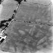 Bankhead, Dalswinton, oblique aerial view, taken from the ESE, centred on the cropmarks of Roman Forts and an oval enclosure.