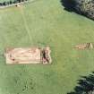 Oblique aerial view of Holywood centred on the excavation of a cursus, taken from the NW.