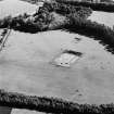 Oblique aerial view of Holywood centred on the excavation of a cursus, taken from the N.