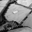 Oblique aerial view of Holywood centred on the excavation of a cursus, taken from the SE.
