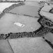Oblique aerial view of Holywood centred on the excavation of a cursus, taken from the W.