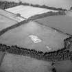 Oblique aerial view of Holywood centred on the excavation of a cursus, taken from the SW.