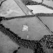 Oblique aerial view of Holywood centred on the excavation of a cursus, taken from the SSW.