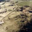 Oblique aerial view centred on the remains of the fort, taken from the ESE.