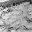 Oblique aerial view centred on the remains of the fort, taken from the W.