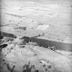 General oblique aerial view looking over the fort towards the River Annan, taken from the SW.