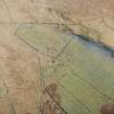 Oblique aerial view of Ettleton Sike centred on the remains of a farmstead, field-system, rig and boundary banks with further boundary banks and rig adjacent, taken from the SE.