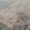 Oblique aerial view centred on the remains of field-systems, rig and boundary banks, taken from the ENE.