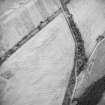 Oblique aerial view centred on the cropmarks of the settlements, taken from the N.