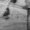 Oblique aerial view of Kirndean centred on the remains of a homestead moat, taken from the E.