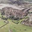 Oblique aerial view of Berwick-upon-Tweed centred on the town and the remains of the town wall and bastions, taken from the N.