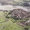Oblique aerial view of Berwick-upon-Tweed centred on the town and the remains of the town wall and bastions, taken from the NNW.