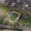 Oblique aerial view centred on the town's football ground, taken from the SE.