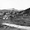 Copy of historic photograph in the Annan Album showing an unidentified view of thatch cottages in Aberfoyle.