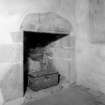 Interior view of Castle Fraser showing detail of fireplace in chapel.