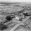 Marine Hotel, Main Street and Gullane Station, Gullane.  Oblique aerial photograph taken facing south-west.  This image has been produced from a crop marked negative.