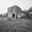 Kirtleton House, Dovecot. General view of W range of courtyard steading from S.