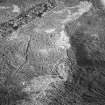 Torbeg and Tormore, oblique aerial view, taken from the NW, centred on two hut-circles. A further hut-circle is visible in the bottom left-hand corner of the photograph.