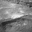 Torbeg, oblique aerial view, taken from the WSW, centred on two hut-circles. A further hut-circle is visible in the bottom centre of the photograph.