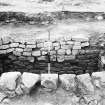 Rough Castle Roman Fort
Excavation photograph: stone-lined pit at N end of Via Principalis, as excavated 1961.