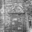 Detail of the buckle quoins and broken pedimented doorway.