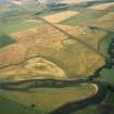 Oblique aerial view showing the cropmarks at Forteviot including the Roman temporary camp.