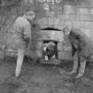 Falkland Palace Excavations
Frame 18 - Workman emerging from latrine outlet which links with vault F002 - from east
