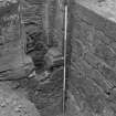 Falkland Palace Excavations
Frame 10 - East end of Trench 5b, showing latrine chute in east wall of Cellar G and construction trench for east wall of cellar - from north-west
