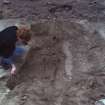 Photograph taken during the Council for British Archaeology 1987 Summer School. Working shot of the excavations, including the excavation of a skeleton.