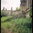 View from NW showing remains of front steps, quadrant screen wall and pavilion, Mavisbank House.