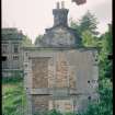 View from NE showing remains of pavilion with main block in background, Mavisbank House.