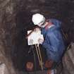 Commission at work: Mr I Parker carrying out plane table survey in the cistern (lower chamber).