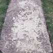 Forgan, St. Fillan's Churchyard.
General view of a recumbant gravestone with decorative border and  skull with 'Memento Mori' ribband.