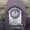 Forgan, St. Fillan's Churchyard.
General view of gravestone. arched backing stone with smaller monument in front. Wreath of stone roses with central rose. 
Insc: 'In Memory of Rosa.M.Ramsay. Born March 3rd 1870 Died July 18th 1878'.