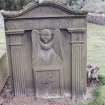 Forgan, St. Fillan's Churchyard.
General view of gravestone with fluted pilasters and curved pediment with a winged soul and panel with initials and shuttle.
Insc: 'W.H  E.A.Y'