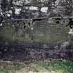 View of grave slab mounted on wall.