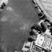 Pitmuies, oblique aerial view, taken from the NW, centred on the cropmarks of a pit-circle. Pitmuies garden is visible in the bottom right-hand corner of the photograph.