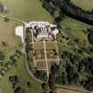 Oblique aerial view centred on the country house and garden, taken from the SW.