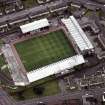 Oblique aerial view centred on St Mirren football stadium, taken from the NE.