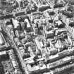 Oblique aerial view showing area surrounding Cowgate, including Chambers Street to left of photograph, George IV Bridge at top, High Street to right, and South Bridge to bottom