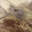 Oblique aerial view centred on the farmsteading, taken from the W