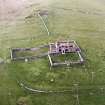 Oblique aerial view centred on the ruins of the Laird¿s House, taken from the S.