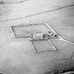 Oblique aerial view of the laird¿s house, garden walls and the farmsteading, taken from the SSW.