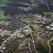 Oblique aerial view centred on the village, miners¿ rows and colliery, taken from the NW.