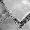 Oblique aerial view centred on the cropmarks of the ring-ditch with lodge adjacent, taken from the WNW.