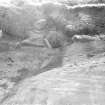 Photograph showing coastal erosion of structural features.