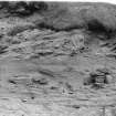 Photograph showing coastal erosion of structural features.
Plate vi, p91 GAJ 1985 vol.2  Detail of erosion, showing lower level of structural features.