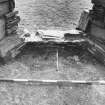 Excavation photograph : west range - room 1, east window deposits, from west.